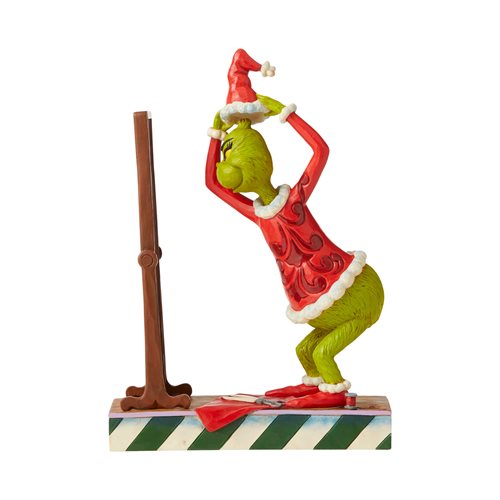 Dr. Seuss The Grinch Dressing in Santa Suit Statue by Jim Shore
