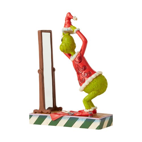 Dr. Seuss The Grinch Dressing in Santa Suit Statue by Jim Shore
